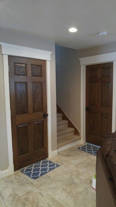 Wall Trim And Door Colors, Dark Stained Doors With White Trim, Dark Wood Doors With White Trim, White Trim With Stained Doors, Brown Doors White Trim, Oak Doors With White Trim, Stained Doors With White Trim, Dark Stained Doors, Wood Doors With White Trim