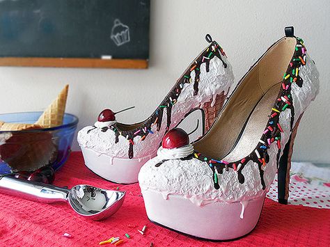 We’ve got new additions to our food-themed shoes that could really ruin a diet list. Online store Shoe Bakery decorates shoes so that they look like sweet treats that literally look good enough to eat. Pumps, flats, and boots are frosted with acrylic icing, laced with chocolate-colored paint, and garnished with faux-food toppings like cherries, oreos, and rainbow sprinkles. If you find it weirdly tempting to take a bite into these realistic, mouth-watering creations, you’re not alone; Shoe ... Ice Cream Shoes, Cream Heels, Chic Shoes, Shoe Company, Unique Shoes, How To Make Shoes, Crazy Shoes, Custom Shoes, Look Cool