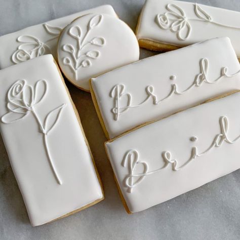 Kayla Block | A quick elegant shower set. Obsessing over the simplicity of white iced cookies. . . . #weddingcookieset #weddinginspiration… | Instagram White And Gold Bridal Shower Cookies, Untraditional Kitchen, Royal Iced Wedding Cookies, White Royal Icing Cookies, Simple Bridal Shower Cookies, White Cookies Decorated, Bridal Shower Royal Icing Cookies, Wedding Shower Cookies Decorated, White Wedding Cookies