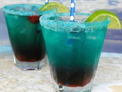 Shark Bite Drink Recipe: A Stunning Visual Guide - RecipeStrip Shark Bite Drink, Shark Bite Drink Recipe, Summer Beverages, New Year's Eve Countdown, Lime Tart, Beach Cocktails, Malibu Rum, Slice Of Lime, Summertime Drinks