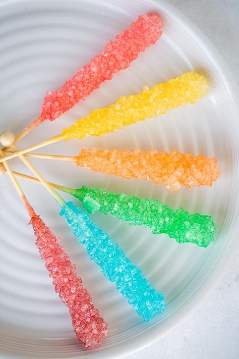 DIY Rock Candy - Rock Candy on a Stick is easy to make and a fun experiment for the kids! This Homemade Rock Candy will develop large sugar crystals over a 7 day period and will make the perfect sweet treat for your little helpers afterward. #cookiedoughandovenmitt Making Rock Candy, Diy Rock Candy, Homemade Rock Candy, Rock Candy Recipe, Candy On A Stick, Make Rock Candy, Candy Experiments, Fun Experiments For Kids, Homemade Lollipops