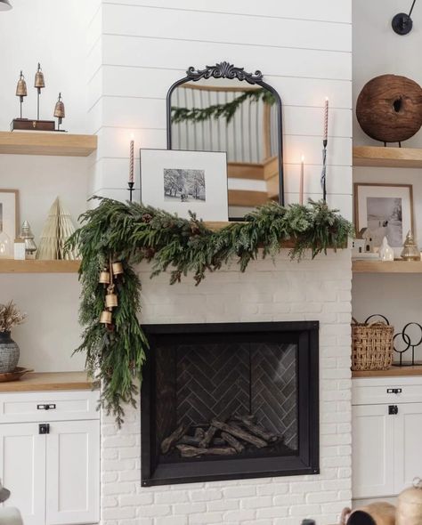 We're sharing 17 Christmas mantel decor ideas you will love! Neutral and colorful, simple and extravagant we have you covered with decor ideas for the holiday season! Fireplace Winter Decor, Modern Farmhouse Christmas Mantle, Fireplace Mantle Greenery, Modern Christmas Fireplace, Modern Christmas Mantle Decor, Christmas Fireplace Mantel Decor, Mantle Christmas Decor Ideas, Fireplace Mantel Decor Ideas, Christmas Fireplace Mantel