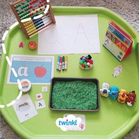 We love this letter A tuff tray- so many different activity ideas to become familiar with the first letter of the alphabet. Thank you @all.about.the.play (on instagram) for sharing this great photo- so many ideas to make learning fun.   They made the letter A in a tray of rice, made the letter A from playdough and created an A shape using pom poms. Alphabet Tuff Tray Ideas, Letter Tuff Tray Ideas, Dough Mats, Class Activity, Eyfs Activities, Initial Sounds, Letter Tray, The Letter A, Tuff Tray