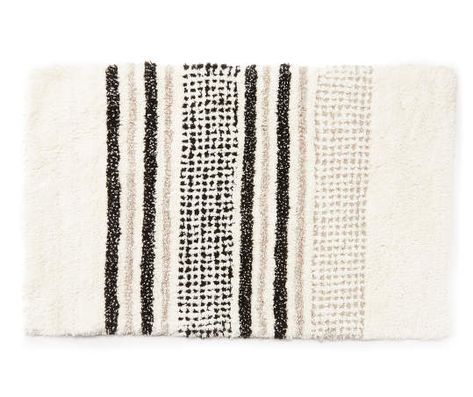 Indulge in soft comfort underfoot with this bath rug. It features black, tan and white stripes in varied styles. Set it in front of the shower, tub or sink for plush texture and a chic decorative accent in the guest or master bath. Cream And Black Bathroom, Tan And White Bathroom, Black And Tan Bathroom, Black And Beige Bathroom, Beige And Black Bathroom, White And Cream Bathroom, Black And Cream Bathroom, Black And White Bathroom Rug, Black Bath Rug