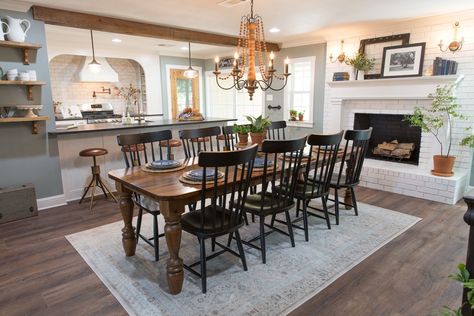 Clint built this table for the Beachums to gather around for holidays together. It turned out perfectly for this space, and the family loved it. Farmhouse Dining Room With Fireplace, Dining Room With Fireplace Layout, Joanna Gaines Dining Room, Fixer Upper Dining Room, Dining Room With Fireplace, Beam Ideas, Joanna Gaines Decor, Fireplace Dining Room, Ranch Home Remodel