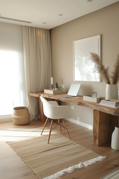 A minimalist home office focuses on simplicity and function, removing unnecessary clutter. Click for more ideas. Modern Cozy Home Office, Home Office Organic Modern, Natural Desk Setup, Neutral Boho Office, Boho Minimalist Office, Simplistic Office, Modern Organic Office, Organic Modern Office, Minimalist Home Office Ideas