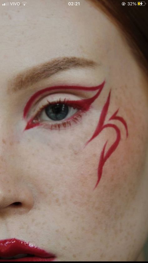 Aespacore Makeup, Fire Inspired Makeup Look, Red Face Paint Ideas, Asymmetrical Eyeliner, Easy Graphic Eyeliner Hooded Eyes, Dragon Eyeliner, Fantasy Eyeliner, Red Graphic Eyeliner, Fire Eyeliner