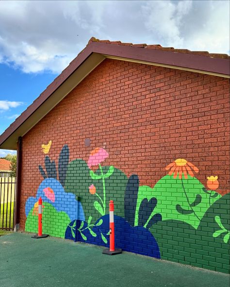 Day 1, @stpaulskealba 🌿 ⚡️Assist @sadie.neave @danielle.monique.art 📍Client @stpaulskealba 👍🏼Paint @resene lumber side & @duluxaus weathersheild #ladieswhopaint #heynicemurals #playground #playmural #melbournemurals #mural #brightmural #educate #schoolmural #school #brightwalls #schoolartwork #schoolmurals #kealbaprimary #murals #muralart #kealba School Walls Painted, Bike Mural Wall Art, Playground Murals Schools, Community Garden Mural, School Mural Ideas Outdoor, Elementary School Murals, Daycare Mural, Bee Mural, Playground Mural