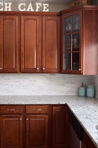 White Marble Kitchen Backsplash Tile  with Blanco Granite and Dark Cherry Cabinets. Melded vintage styling and transitional kitchen design. White Kitchen Marble Backsplash, White Marble Backsplash, Airy Kitchen, Backsplash With Dark Cabinets, Marble Backsplash Kitchen, Trendy Kitchen Backsplash, Transitional Kitchen Design, White Marble Kitchen, Cherry Kitchen