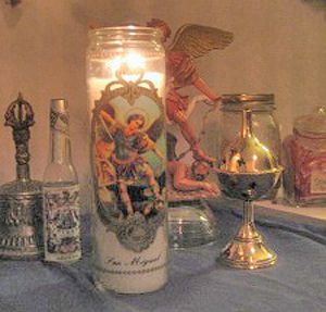 Tip: Notice the Catholic Saint Michael vigil light, Tibetan Buddhist ganta bell, and Afro-Caribbean Florida Water on this altar? That's your cue that this practitioner is eclectic and merges many paths in her way of working St Michael Altar, Afro Caribbean, All Girls School, Florida Water, Catholic Saint, African Spirituality, Saint Michael, Tibetan Buddhist, St Michael