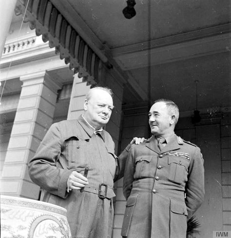 Winston Churchill stands with his hand on a British officer's shoulder while smoking a cigar at the British Embassy in Cairo in August 1942. Dwight Eisenhower, British Prime Ministers, Historical People, Military Uniforms, Photo Banner, American Presidents, Poster Pictures, Winston Churchill, Great Leaders