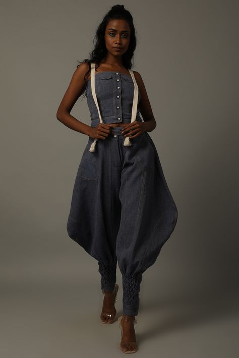 Featuring an indigo blue corset in handwoven cotton khadi denim base with white yarn suspenders. It is paired with matching pants having smocking.  FIT: Fitted at bust and waist. COMPOSITION: Handwoven cotton khadi denim. CARE: Dry clean only. Blue Corset, Dhoti Pants, Indian Fashion Designers, Indigo Blue, Pants Design, Pernia Pop Up Shop, Mustard Yellow, Suspenders, Smocking