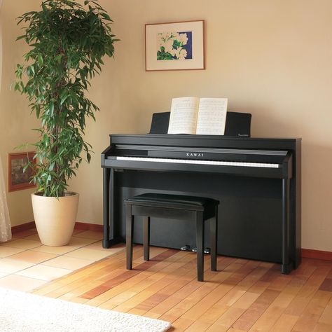 If you haven't tried Kawai digital pianos lately, you'll be astonished by their exquisite sound and feel. A Kawai digital piano is the perfect cultural and educational addition to your home. #kawaipiano #digitalpiano #music #piano #pianogram #musiceducation Piano Corner, Modern Industrial Apartment, Neutral Apartment Decor, Piano Room Decor, Piano Living Rooms, Piano Table, Piano Stand, Home Office Layouts, Piano Decor