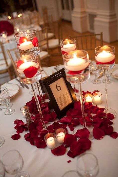 something so simple yet so elegant and romantic.Candle centerpieces with rose petal accents Rose Petal Candle, Red And White Weddings, Candle Table Decorations, Rose Centerpieces, Red Rose Petals, Wedding Centerpieces Diy, Rose Candle, Diy Centerpieces, Tree Wedding