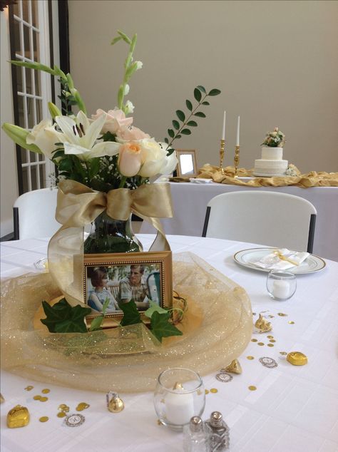 50th Wedding Anniversary Centerpiece. Gold, Roses, Ivy, chocolates, confetti, gold tulle,votives 50th Centerpieces, Anniversary Party Centerpieces, 50th Anniversary Table Decorations, 50 Wedding Anniversary Centerpieces, 50th Anniversary Table, 60th Wedding Anniversary Decorations, Wedding Anniversary Centerpieces, 50th Anniversary Centerpieces, Photo Centerpieces