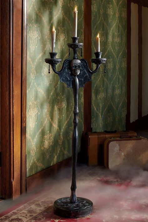 This spooky haunted candelabra stands over 5 feet tall and seems to float across the floor all around the room when it detects sounds. Candelabra Halloween, Halloween Hunt, Halloween Candelabra, Animated Halloween Props, Faux Candles, Witch Silhouette, Black Cat Silhouette, Halloween Mantel, Halloween Figures