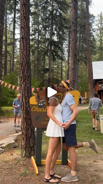 Charlotte Erin Massey on Instagram: "One of my favorite parts of our camp themed wedding was our welcome party!   Tom and I really wanted to get the party started as soon as guests arrived to the venue, and help our guests start meeting new friends as early as possible.   We had two friends serve as “camp counselors” for rival summer camp-style teams, which were designated by whether you chose a gold or green bandana that I designed as your wedding favor. Our guests really got into the fake rivalry, and the bandanas added an easy point of connection early in the wedding weekend!   The camp counselors were also in charge of checking everyone in as they arrived and making sure they knew the schedule and where they were sleeping. The check-in process worked especially well because it also gav Mess Hall Camp, Camp Wedding Decor, Camp Wedding Theme, Adult Summer Camp Theme Party, Summer Camp Wedding Theme, Summer Camp Theme Party, Silver Briefcase, Camping Theme Wedding, Camp Wedding Ideas