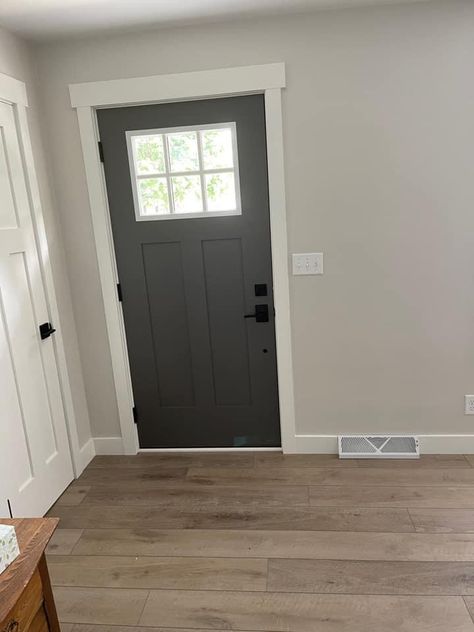 Charcoal Doors With White Trim, Grey Doors White Walls Interior, Sw Modern Gray Walls, Light Walls With Dark Trim Paint Colours, Modern Farmhouse Walls And Trim, Dark Gray Interior Doors With White Trim, Black House Trim Inside, Sw Trim Paint Colors, Sw Peppercorn Interior Doors