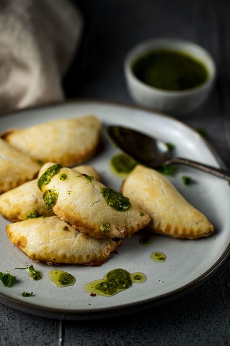 These Vegetarian Empanadas are made with smoky poblano peppers, paprika, creamy cheese, a little onion & fresh cilantro in a buttery, flaky pie crust. Served with a fresh chimichurri sauce for dipping, these bean empanadas are the perfect party or game day appetizer! These homemade empanadas are so easy to make and so incredibly delicious - they will please everyone!! #wenthere8this #vegetarianempanadas #homemadeempanadas #empanadas Bean Empanadas, Empanada Recipes, Homemade Empanadas, Vegetarian Empanadas, Buttery Flaky Pie Crust, Cheese Empanadas, Desert Theme, Poblano Peppers, Chimichurri Sauce