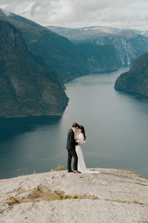 Adventurous Norway Elopement | Wedding Photographer - Emily Kidd Photo. A bride and groom hiking to their wedding ceremony in the Fjords of Norway. Their outdoor wedding ceremony had incredible views! See the views at https://emilykiddphoto.com/adventurous-norway-elopement-wedding-photographer/ #norway #aurland #fjord #wedding #elopement #elope #norwaywedding #norwayweddingphotographer Norway Engagement Photos, Fjord Wedding, Norway Elopement, Wedding Views, Norway Wedding, Dead Horse Point State Park, Elopement Wedding Dress, Pagan Wedding, Neutral Wedding Colors