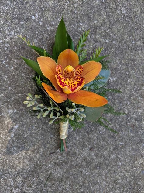 Orange with greenery boutonniere and gold wrap Orange Orchid Boutonniere, Orange Flower Boutonniere, Orange Orchid Bouquet, Wedding Buttonnaire, Orange Boutineer, Orange Corsage And Boutonniere, Tropical Boutonniere, Orange Corsage, Corsage Wedding Mother