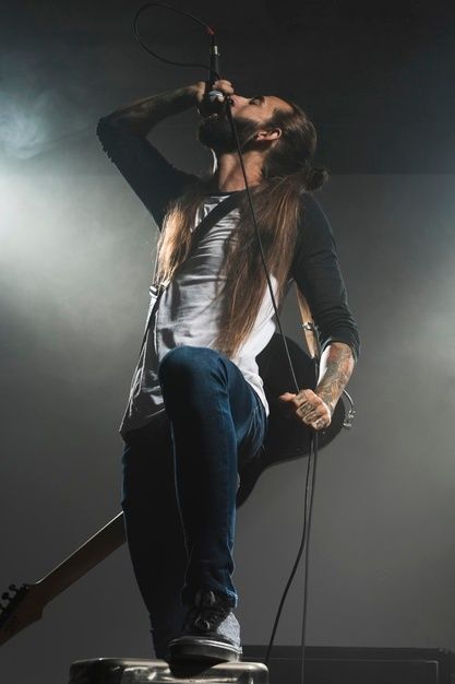 Artist singing on stage and holding a gu... | Free Photo #Freepik #freephoto #music #microphone #rock #stage Singing With Microphone Pose, Singing Into Microphone Reference, Person Singing Into A Microphone, Person Holding Microphone Reference, Holding A Microphone Pose, Singing Reference Pose, Microphone Pose Reference, Holding Microphone Reference, Singing Pose Reference