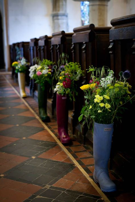 A DIY Village Fete Wedding: Charlie & Jo Flowers In Wellies, Gum Boots, Gardening Boots, Boots With Flowers, Glamping Wedding, Ceremony Decorations Outdoor, Meadow Wedding, Church Pews, Village Fete