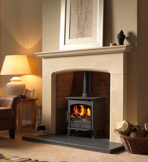 Stone fire surround to wood burning stove Wood Burner Fireplace, Log Burner Living Room, Log Burner Fireplace, Limestone Fireplace, Multi Fuel Stove, Urban Interiors, Rustic Fireplaces, Stove Fireplace, Log Burner