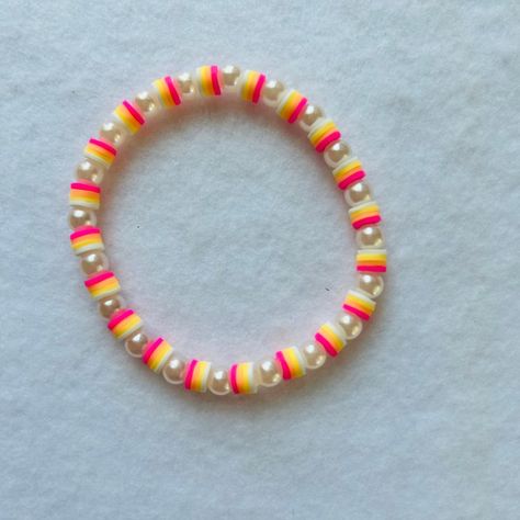 Never Worn/No Damage! Stackable Clay Bead Stretch Bracelet! *This Contains 1 Bracelet Size Is About 7” Can Fit Adults With A Larger Sized Wrists. Contains 4 Different Colors... White, Yellow, Orange And Pink 6mm Clay Beads. Also Has A Cute Peral Spacers All Around The Bracelet!!! This Would Be Such A Cute Gift For Yourself Or Anyone!! The Camera Will Make The Bracelets Seem Brighter Or Darker In The Photos. So Your Bracelets May Be A Little Lighter Or Darker In Person. I Assure You All My Bracel Clay Beads With Pearls, White And Gold Clay Bead Bracelet, Clay Braclets Idea Summer, Pastel Clay Bead Bracelet, Clay Bead Color Combos, White Clay Bead Bracelet, Bracelets With Pearls, Bracelet Clay Bead, Make Clay Beads