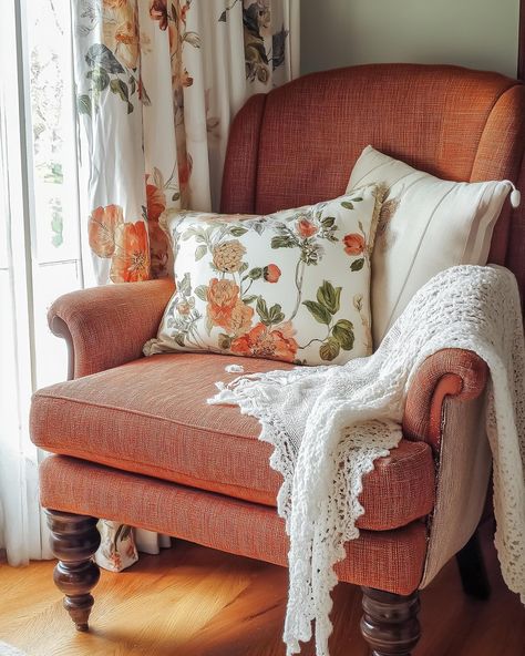 This cozy corner is giving us all the autumn feels 🍂. Vintage floral curtains, a burnt orange armchair, and a soft crocheted throw—what more could you ask for?” #cozyautumn #vintageliving #fallvibes #cottagecore #autumncolors #autumndecor Cottagecore Armchair, Orange Armchair, Floral Armchair, Floral Curtains, Fall Feels, Autumn Cozy, Cozy Corner, Cottage Core, Fall Vibes