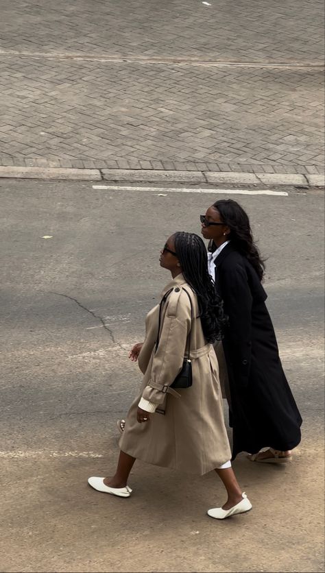 Birds Eye view of two black women  with braids and wavy hair  in a beige and black trench coats crossing the street in the city of Nairobi . Shot in an editorial fashion shoot style Scandinavian Clothing Style, Black Girls Fashion, Barcelona Spring, Black Coat Outfit, Dump Pics, Trench Outfit, Nairobi City, Semester Abroad, Brand Aesthetic