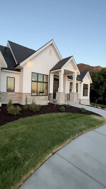 Parade Of Homes Exterior, Rock Front House Exterior, Ranch House Front Door Ideas, White Brick House With Stone Accents, Classic Modern Home Exterior, Interior Modern House, White House With Brick Skirting, White House Exterior With Stone, Stone On Bottom Of House Exterior