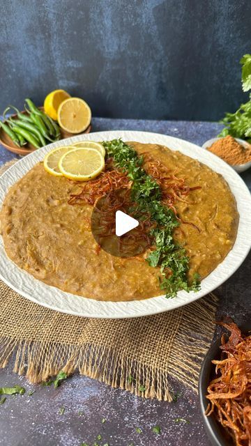 Zubda Malik on Instagram: "Haleem (Reshaydaar haleem for Niaz)   Haleem Recipe:  Ingredients: - 1.5 kgs Beef or Mutton boneless - 1 cup Oil - 1 onion thinly sliced - 3 tbsp Ginger Garlic Paste - 2 litres of water - 1 cup wheat cracked - ½ cup Barley - ⅓ cup Channa Daal - ⅓ cup Rice - ⅓ cup Channa Daal - ⅓ cup Urad Daal - ¼ cup Masoor Daal - ¼ cup Moong Daal - 1 tsp Turmeric - 1 ½ tbsp Salt - 1 ½ tbsp Chilli Powder - 2 tbsp Cumin Powder - 2 tbsp Coriander Powder - 1 tbsp Garam Masala  For Garnish: - Coriander chopped - Fried onions - Green chillies sliced - Lemon wedges - Chaat masala - Ginger julienne cut  Instructions:  1. Combine cracked wheat, barley, rice, channa, urad, masoor, and moong lentils. Rinse thoroughly and soak overnight. 2. In a large pot, heat oil and fry the sliced onions Haleem Recipe, Barley Rice, Sliced Lemon, Cracked Wheat, Ginger Garlic Paste, Tasty Recipes Videos, Chaat Masala, Coriander Powder, Garlic Paste