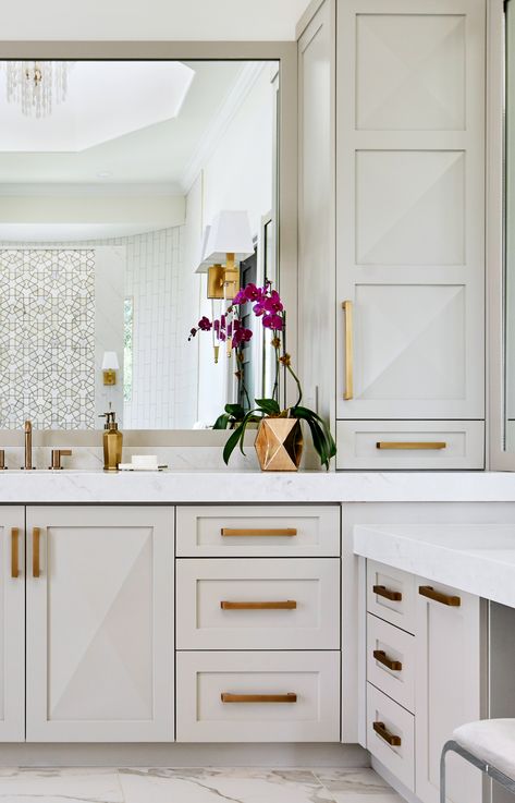 Soft taupe custom cabinets with antique gold hardware grace this luxurious master bath by Haven Design & Construction. The raised cabinet design on the doors echoes the marble and mosaic tile across the bathroom. This bathroom also features a freestanding tub, a shell chandelier in the 22' high cupola, a striking gold and marble mosaic accent wall behind the tub and a curved walk in shower. Luxurious Master Bath, Fossil Creek, Best Kitchen Design, Wall Cabinets, Master Bath Remodel, Home Luxury, Casa Exterior, Gold Bathroom, Diy Bathroom Decor