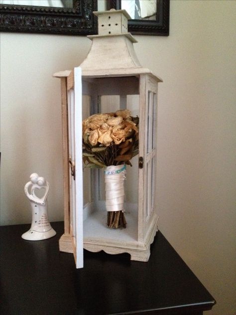 We dried my wedding bouquet and keep it closed up in this glass latern. I still have the charm on it that my goddaughter made me. Wedding Dress Lace Aline, Sleeve Wedding Dress Lace, Wedding Shadow Box, Wedding Bouquet Preservation, Long Sleeve Wedding Dress, Bouquet Preservation, Budget Ideas, Wedding Dress Lace, Long Sleeve Wedding Dress Lace