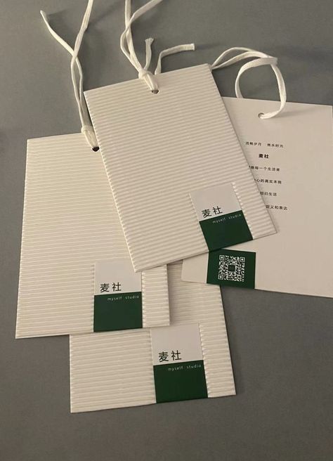 Textured paper hang tags with cotton string made of corrugated paper, another marketing tool for brand identity. Trim Tex, Clothing Labels Design, Hang Tag Design, Corrugated Paper, Cotton String, Textured Paper, Tag Design, Paper Tags, Gift Vouchers