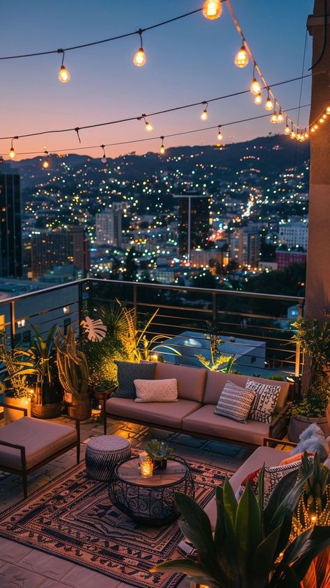 Serene rooftop terrace with string lights and outdoor furniture overlooking cityscape at magic hour. Ideal outdoor retreat for relaxation. Balcony String Lights, Relaxing Outdoor Spaces, View Of City, Comfortable Outdoor Furniture, Interior Design Your Home, Relaxing Outdoors, Magic Hour, Cozy Room Decor, Home Design Living Room