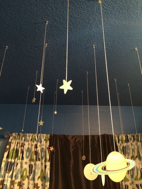 Hang glow in the dark stars from the ceiling to give them a more three dimensional look that's out of this world! I used a hot glue gun, string and thumb tacks. Bedroom Ceiling Hanging Decor, Glow In The Dark Stars On Ceiling Aesthetic, Glow In The Dark Stars On Ceiling Ideas, Light Up Stars On Ceiling, Cool Things To Hang From The Ceiling, Glowing Stars On Ceiling, Stuff To Hang On Your Ceiling, Funky Ceiling Lights, How To Hang Things From The Ceiling