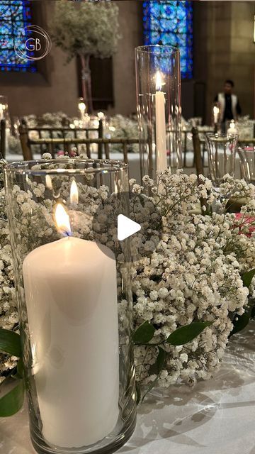 Flowers 🌺 By G Bella- Wedding Stylist|Floral Designer on Instagram: "Have you ever wondered how to create that lush, full look for your long table receptions? Baby's breath is the secret ingredient! Paired with delicate candle holders, it adds warmth and ambiance to any setting.   Do you want to learn more about how to create stunning floral arrangements? Sign up for our emails and stay tuned for our upcoming online classes! 📩  #FlowersByGBella #WeddingDesign #FloralInspiration #OnlineClass #Learning #WeddingFlowers #WeddingStylist #WeddingDecor #WeddingInspo #WeddingPlanning #EventDesign #WeddingDetails #WeddingStyle #WeddingCenterpiece #Centerpieces" Cylinder Vase Centerpiece Wedding Floating Candles White Flowers, Baby Breathe Center Piece Ideas, Baby's Breath Centerpieces Wedding, Receiving Table Wedding, Main Table Wedding Decoration, Long Table Flower Arrangements, Rectangular Table Centerpiece, Easy Centerpieces For Party, Long Tables Wedding Reception