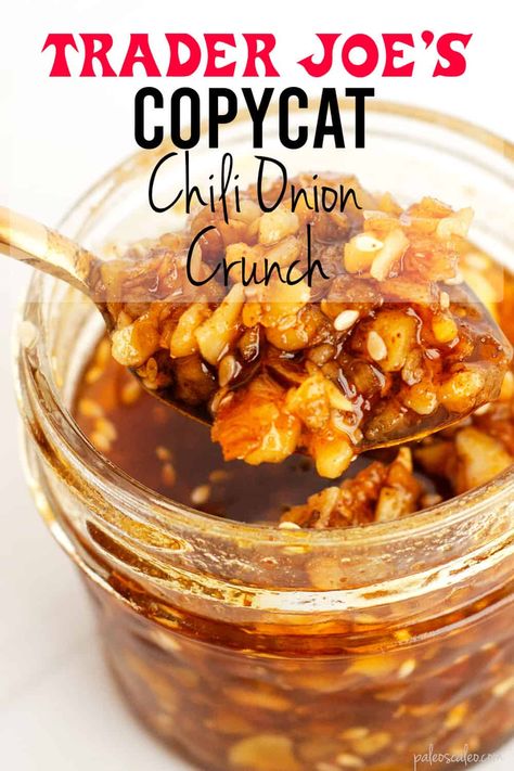 glass jar of chili onion crunch with spoonful being lifted out Onion Chili Crunch, Trader Joes Onion Crunch, Crunchy Onion Chili Oil Trader Joes, Trader Joe’s Chili Onion Crunch, Crunchy Onion Chili Oil, Almond Crunch, Whole30 Dinner Recipes, Crunch Recipe, Trader Joe's Products