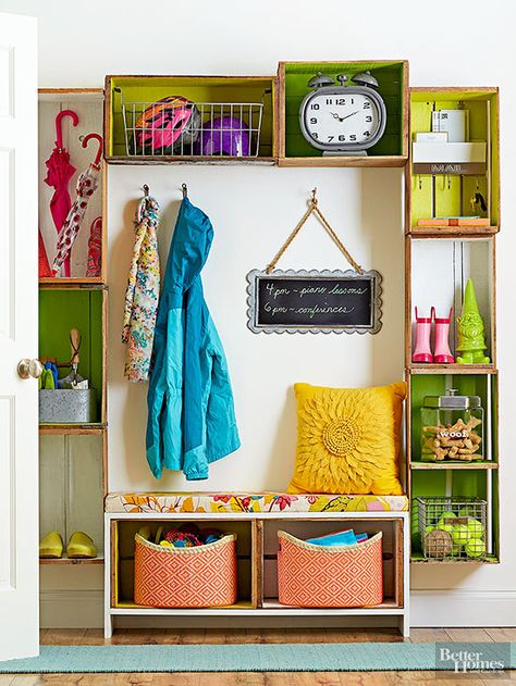 Give yourself a bright and vibrant front entry, mudroom, or garage storage system using about a dozen beautiful vintage wood crates. A combination of a homemade wood crate bench, shelving, and other storage solutions bring the entryway solution together. Crate Bench, Vintage Wood Crates, Diy Kitchen Storage, Entryway Storage, Diy Holz, Crate Storage, Wood Crates, Diy Storage Furniture, Wooden Crates