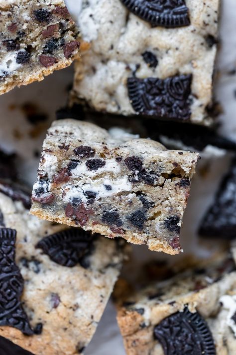 These Cookies and Cream Bars are loaded with pieces of Hershey’s Cookies ‘n’ Creme candy bars, mini chocolate chips and chopped Oreo chunks! They are soft, flavorful, and are the cookies and cream bars of your dreams. #cookiesandcream #cookies #cookiesandcreambars #desserts #oreos #oreodesserts #whitechocolate #hersheys #krollskorner Cookies And Cream Bars, Banana Chocolate Chip Bars, Krolls Korner, S Cookies, Pumpkin Pie Bars, Cream Candy, Pie Bars, Oreo Dessert, Cookies N Cream Cookies