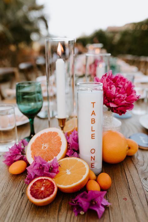 Quirky Table Centerpieces, Citrus Table Centerpiece, Pastel Place Setting, Bougainvillea Centerpiece Wedding, Mexico Wedding Table Numbers, Quirky Bridal Shower Ideas, Tye Dye Wedding Ideas, Citrus Theme Party Decor, Outdoor Tropical Decor