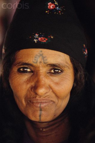 Jordan | Bedouin Woman.  Petra | © Annie Griffiths Belt Tuareg Braids, Bedouin Woman, Mother Images, Western Tattoos, Petra Jordan, Facial Tattoos, Desert Life, Historical People, Divine Mother