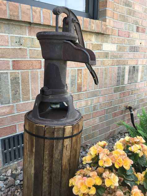 After- Stand for my old hand pump Vintage Well Pump Ideas, Old Well Pump Ideas Water Features, Creative Ways To Cover Well Pump, Pitcher Pump Ideas, Well Pump Cover Ideas Diy, Well Pipe Cover Ideas, Pipe Covering Ideas, Well Head Cover Ideas, Well Pump Cover Ideas