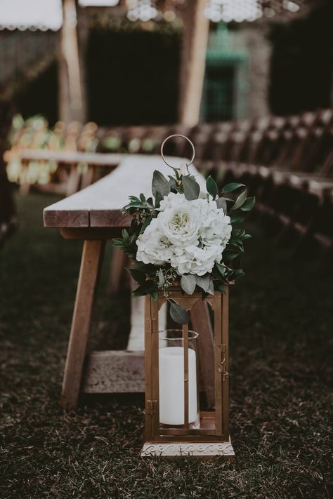 Benches intermingled with chairs. Lanterns instead of large floral arrangements. Wedding Aisle With Benches, Bench Aisle Decorations Wedding, Bench Decor For Wedding, Bench Seating Wedding Ceremony, Wedding Aisle Benches Decor, Lanterns Along Wedding Aisle, Wedding Ceremony Lanterns Aisle, Outdoor Wedding Ceremony Decorations Aisle Benches, Wedding Lanterns Aisle