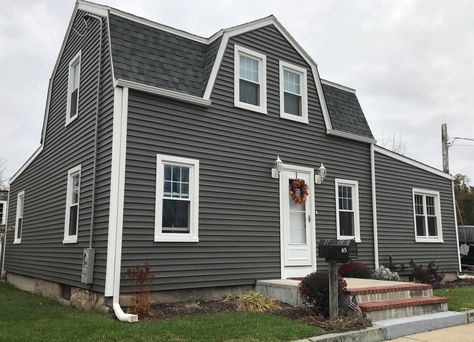 This Acushnet, MA home got an exterior makeover with new Mastic Vinyl Siding in the color, Misty Shadow and Harvey Windows. As well as matching the existing roof with Tamko Heritage roofing in the color, Virginia Slate. Looking to give your home an exterior makeover? We provide homeowners with professional grade products, quality craftsmanship, and outstanding customer service. Get a FREE quote by calling (508) 997-1111. #contractor #AcushnetMA #VinylSiding #ReplacementWindows #Roofing Misty Shadow Siding, Vinyl Siding Ideas, Mastic Vinyl Siding, Mastic Siding, Siding Ideas, Grey Siding, Siding Trim, Cape Cod Ma, Home Exterior Makeover