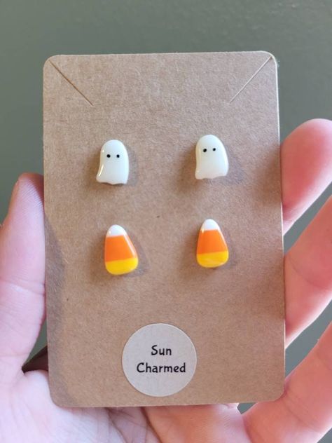 Super fun Halloween Candy Corn and Ghost Stud Earring Set. Each package comes with 1 set of Candy corn studs and 1 set of Ghost Earrings. Materials: The metal material is stainless steel and nickel free. Stainless steel is hypoallergenic and suitable for sensitive skin. The ghost and candy corn are made of polymer clay and glazed for a finished look. Size: The ghost and candy corn are approximately 1cm in length and .75cm in width. Care Instructions: Remove when sleeping and entering water.  Not Candy Corn Polymer Clay Earrings, Candy Corn Clay Earrings, Candy Corn Earrings Diy, Seasonal Polymer Clay Earrings, Polymer Clay Stud Earrings Ideas, Clay Stud Earrings Diy, Polymer Clay Earrings Halloween, Polymer Clay Halloween Earrings, Halloween Polymer Clay Ideas