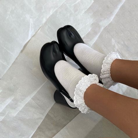 black tabi boots worn with white lace socks margiela tabi boots instagram fashion archive tabi heels tabi sandals Black Tabi Boots Outfit, Tabi Slingback Outfit, Tabi Sling Back, Tabi Shoes Aesthetic, Tabi Heels Outfit, Tabis Margiela, White Tabi Boots Outfit, Tabbies Shoes, Socks With Shoes