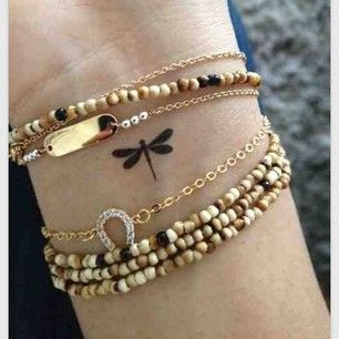 This one maybe in white ink.    A small dragonfly: | 65 Totally Inspiring Ideas For Wrist Tattoos Tattoo Dragonfly, Small Dragonfly Tattoo, Sanskrit Tattoo, Dragonfly Tattoo Design, Tato Henna, Dragonfly Tattoo, Subtle Tattoos, Small Tattoo Designs, Tattoos For Daughters